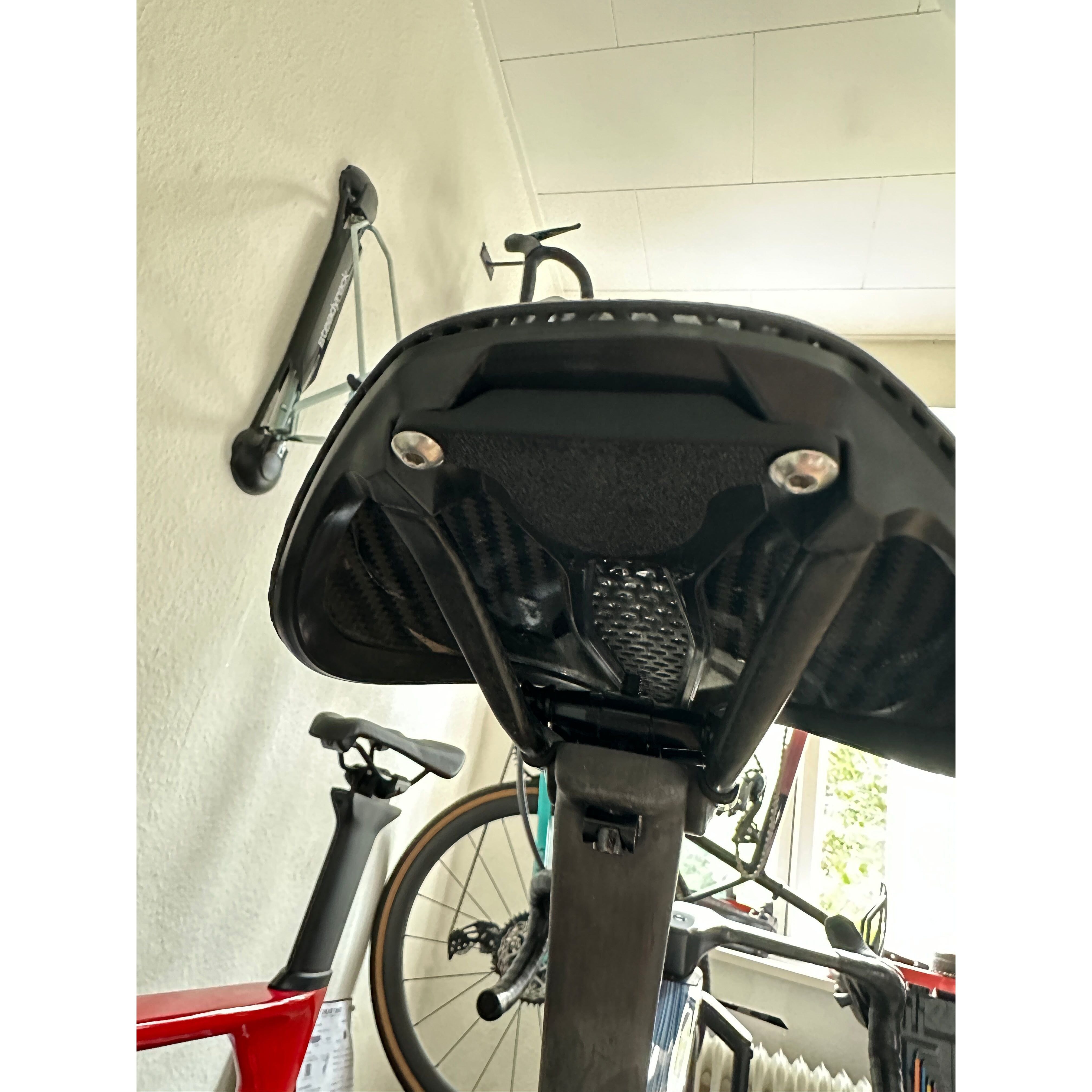 AirTag concealed under bike saddle, hidden from view for anti-theft tracking